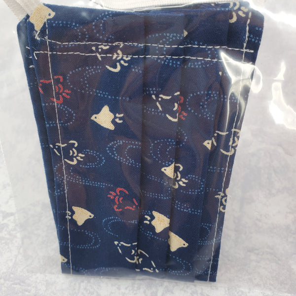 Close up photo of fabric with chidori bird print against a navy background