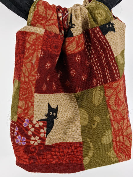 THE TOMI Mini Drawstring Bag: Red & Green Patchwork Print with Black Cats