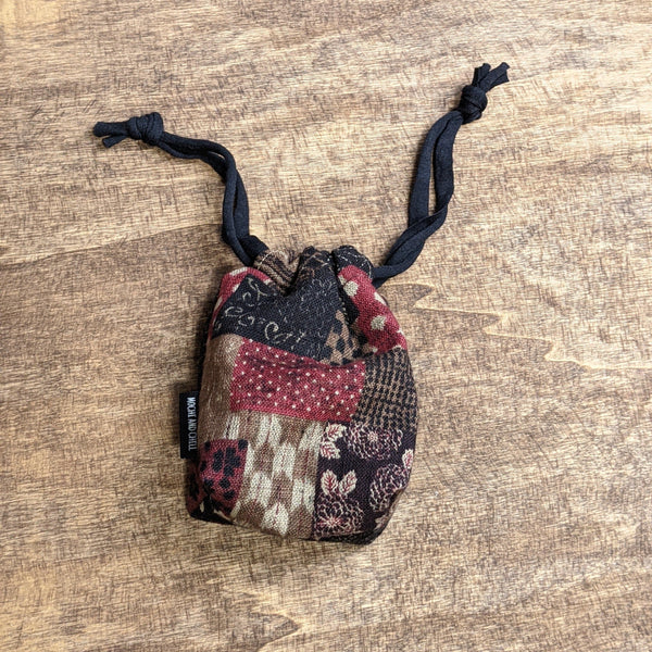 THE TOMI Mini Drawstring Bag: Red & Black Boro Patchwork Print