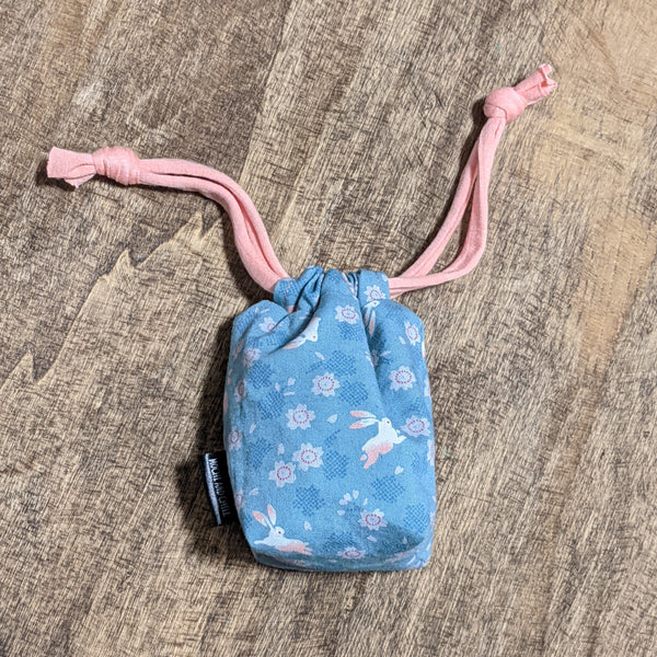 The TOMI Mini Drawstring Bag: Bunnies & Blossoms